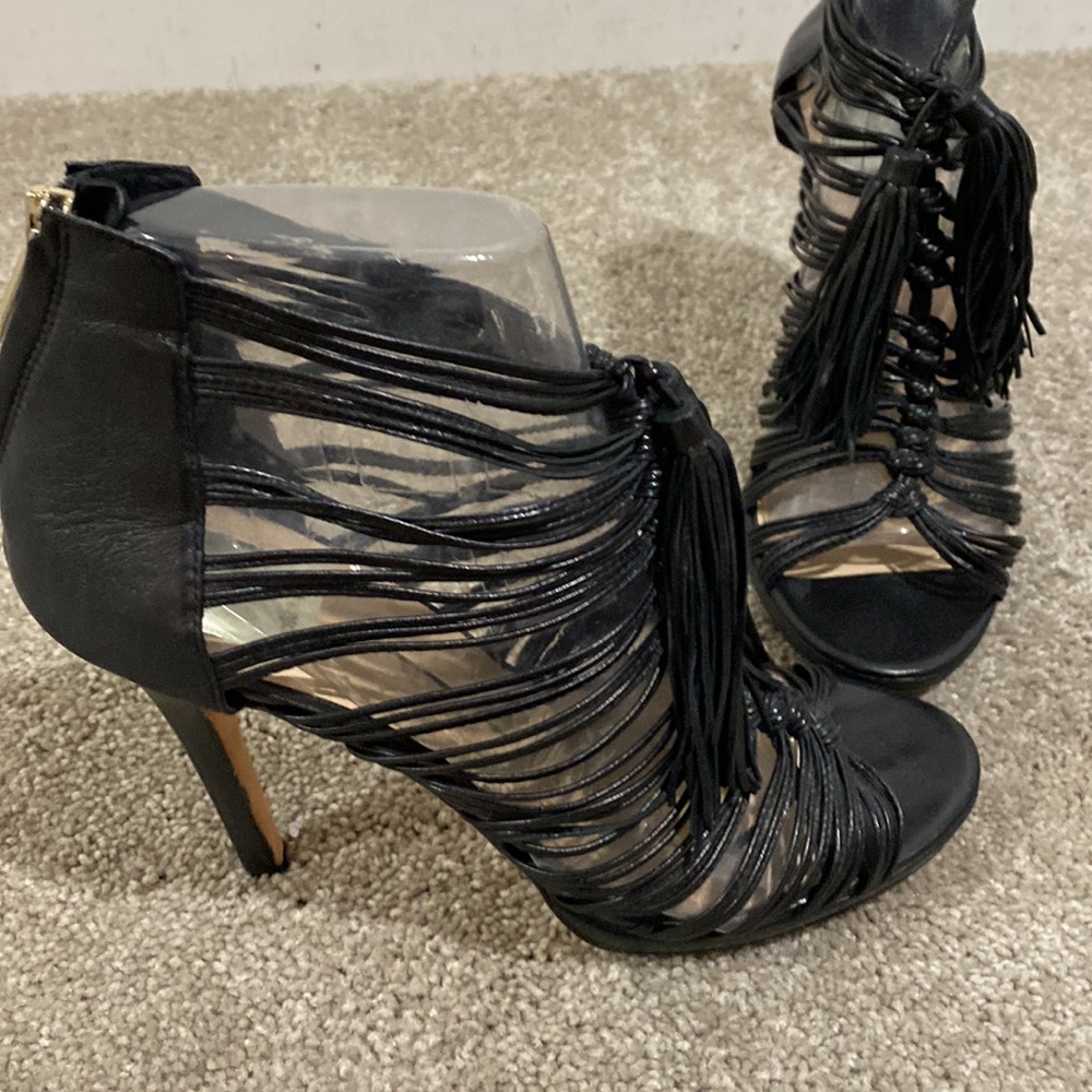 Black hi heeled and tasseled Dolce Vita